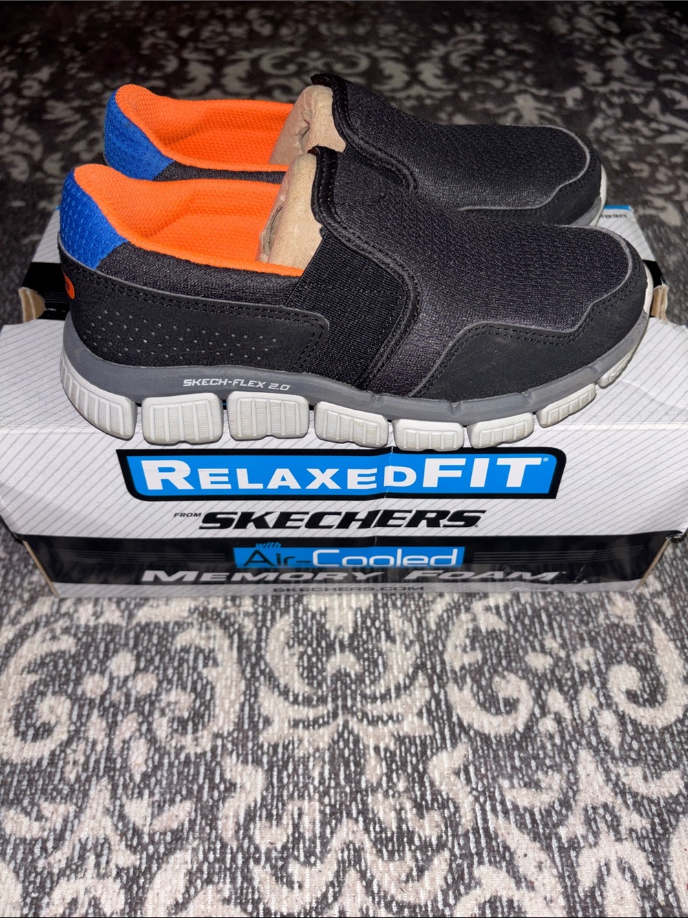 Skechers Black Slip-On Loafers with Orange Lining and Blue Heel